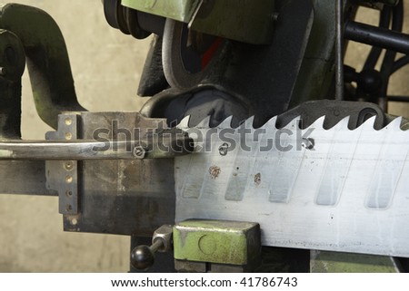 closeup of sharpening tool for industrial saw blade at workshop