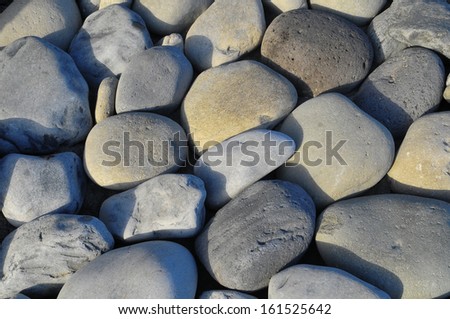 Texture of Round Rocks Smoothed by the Water