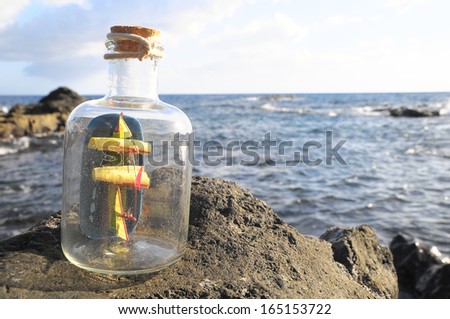 Ancient Spanish Sailing Boat in a Bottle near the Ocean