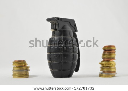 Money for War Concept Hand Grenade and Coins