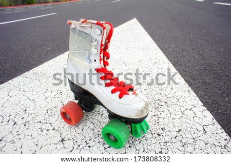 Old Vintage White Skate Boot on the Asphalt Sterret
