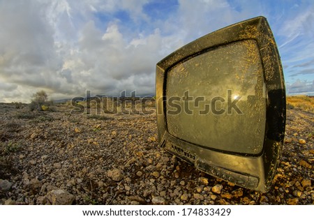 Abandoned Broken Television in the Desert on a Cloudy Day