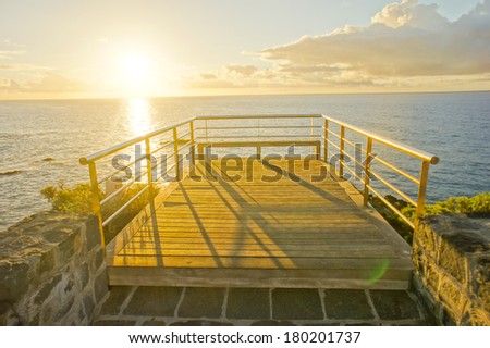 HDR Picture Sunrise on a Pier over Atlantic Ocean in Tenerife Canary Islands Spain