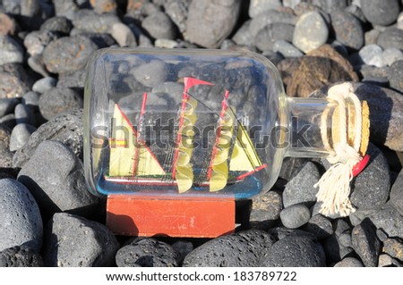 Ancient Spanish Sailing Boat in a Bottle near the Ocean