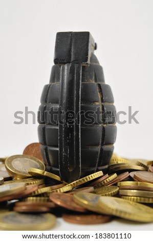 Money for War Concept Hand Grenade and coins