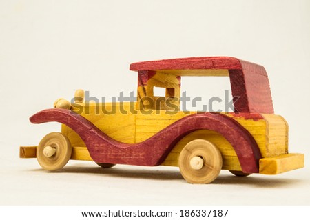 Wooden Toy Red and Yellow Car on a white Backgraund