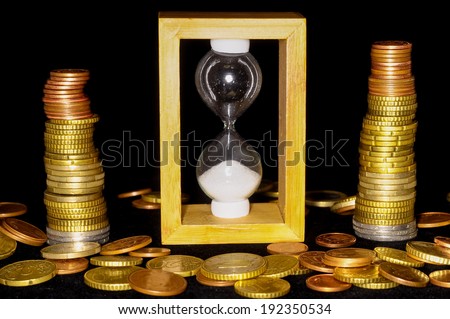 Buisness Time Concept Hourglass and Money on a Black Background