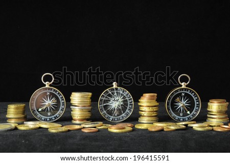 Orientation in Business Compass and Money on a Black Background