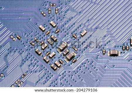 Macro Photo Of Electronic Circuit. Pcb On The Lighting.