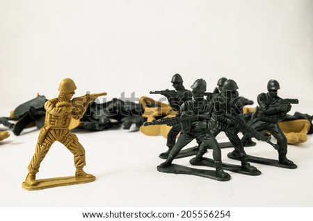 Plastic Lead Soldiers Representing War on a White Background