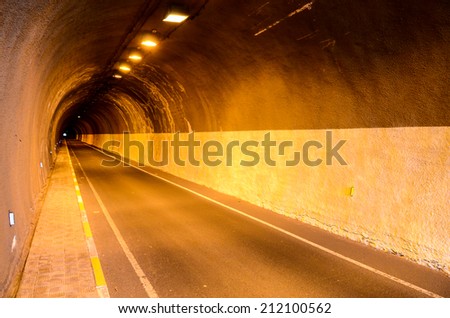 Undergound Dark Tunnel and Road Incandescent Illuminated