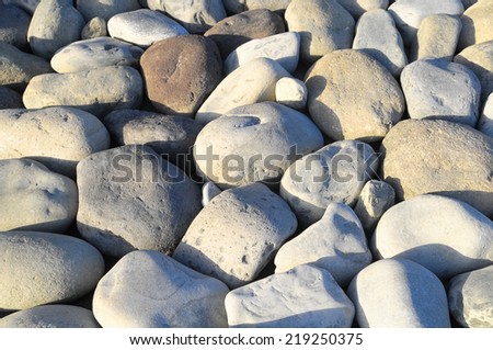 Texture of Round Rocks Smoothed by the Water