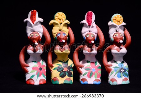 Clay Handmade Statue of a Cuban Woman on Black Background