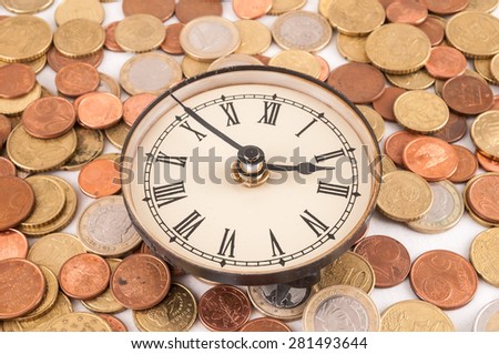 Picture of a Business Money Concept Idea, Clock and Coins