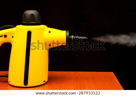 Picture of Yellow Hot Vapor Cleaning Machine