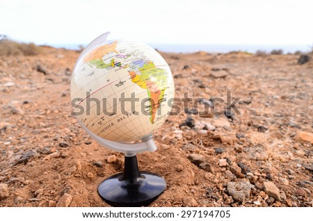 Globe Planet Earth in the Rock Desert