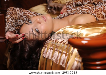 stock photo : Portrait of woman in gold dress in interior