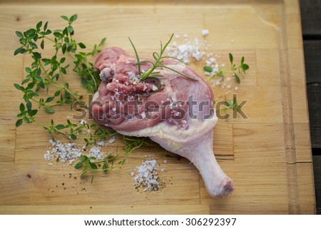 Fresh duck leg with thyme, salt and rosemary