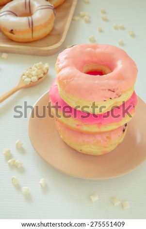 Pink glazed donuts in sweet retro color