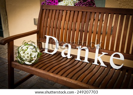 the word thank you on a wooden bench can be used as wedding thank-you gift card