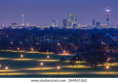 View of the city after sunset from Primrose Hill park in London, England, UK.