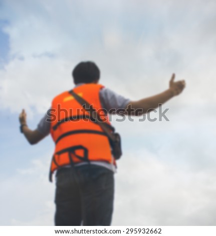 blurred photo of Men standing in a gesture indicating that the sky is vast. Let us come out with something new. vintage color tone