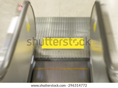blurred of empty escalator stairs logo warning