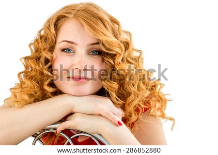the red-haired blue-eyed girl with freckles and curly hair against a white background