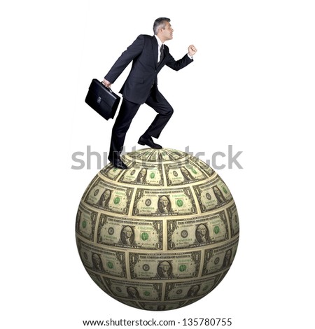 Full body portrait of a businessman on a globe made of money isolated on white background