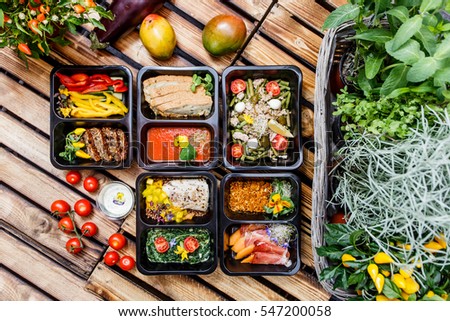 Healthy food and diet concept, restaurant dish delivery. Take away of fitness meal. Weight loss nutrition in foil boxes.