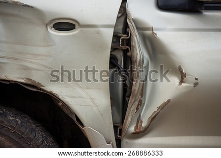 Part of damaged car at the beside