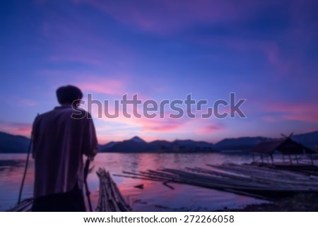 Blur background of a man shooting camera