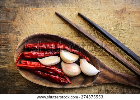 Red dry chillies and garlic in the spoon