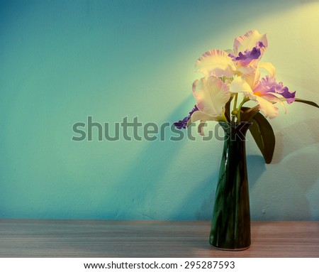 Vase of flowers in dark blue tone