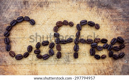 coffee beans word on the old cutting board
