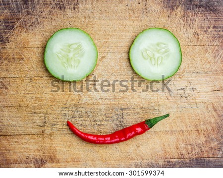 Smile cucumber and chili conceptual photo 
