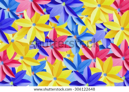 Recycle paper colored flowers seamless background with bright light