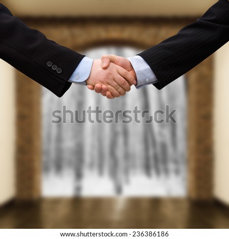 busines man handshake with modern interior background