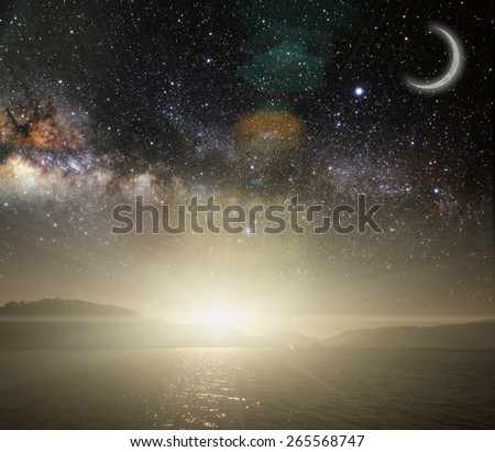 month on a background star sky reflected in the sea. Elements of this image furnished by NASA