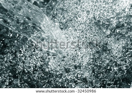 Sparks of blue water on a black background
