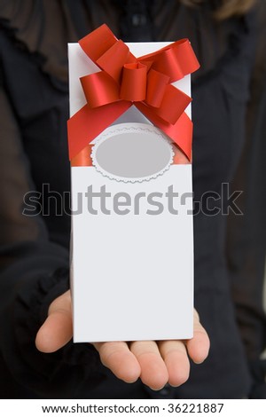 a gift in the hand of girl