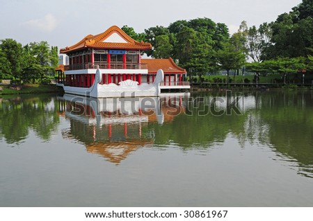 A Chinese Style Pavilion In A Lake