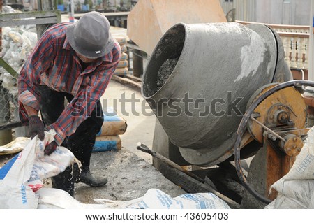 Worker Operating Cement Mixer