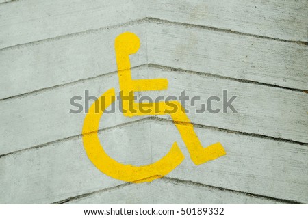 Yellow Sign On Ramp For The Usage Of Wheelchair