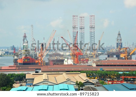 Busy Ship Repair Yard With Cranes