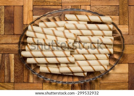 wafer rolls on a wooden surface
