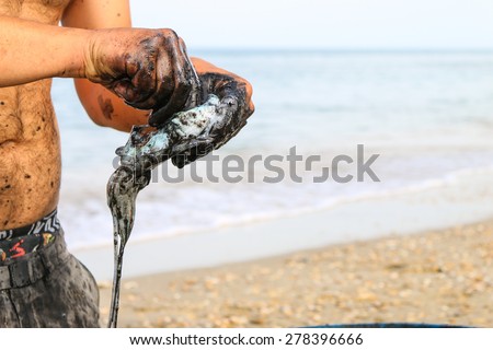 a boy cleans the freshly caught cuttlefish, carefully pull out the bag of ink that distinguishes these animals