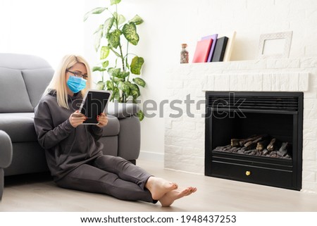 Coronavirus or Covid-19 concept. Business woman working from home wearing protective mask. Business woman in quarantine for coronavirus wearing protective mask. Working from home