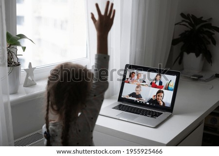 A Girl Video Conferencing With Happy Female Teacher On Laptop