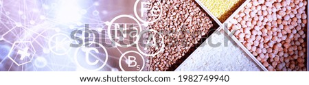 A set of grain cereals. Rice, buckwheat and millet groats in wooden tray. A grocery set of cereals. Import of grain.